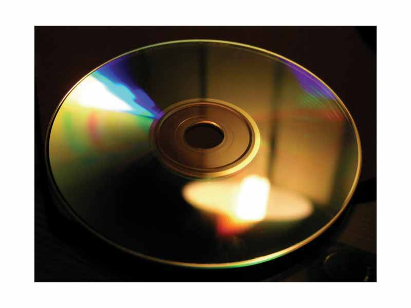 The grooves of a compact disc can act as a grating and produce iridescent reflections.