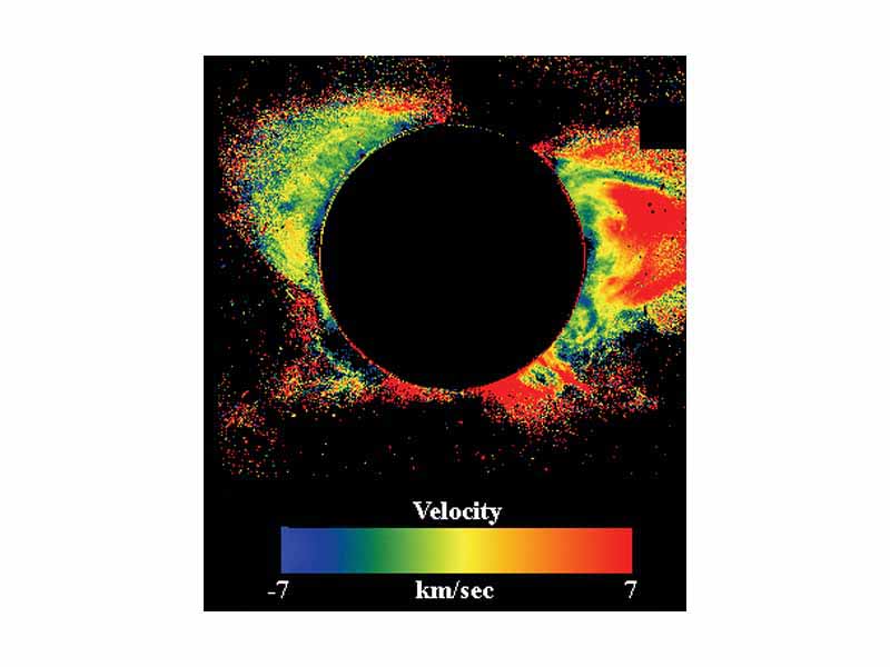 A picture of the solar corona taken with the LASCO C1 coronagraph which employed a tunable Fabry-Pérot interferometer to recover scans of the solar corona at a number of wavelengths near the FeXIV green line at 5308 Å. The picture is a color coded image of the doppler shift of the line, which may be associated with the coronal plasma velocity towards or away from the satellite camera. In calculating the velocity, the velocity due to solar rotation has been subtracted.