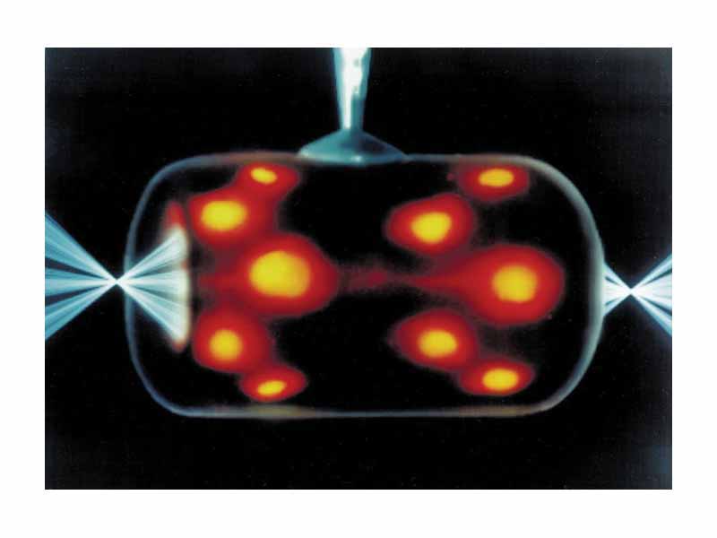 Indirect drive laser ICF uses a hohlraum which is irradiated with laser beam cones from either side on it its inner surface to bathe a fusion microcapsule inside with smooth high intensity X-rays. The highest energy X-rays can be seen leaking through the hohlraum, represented here in orange/red.