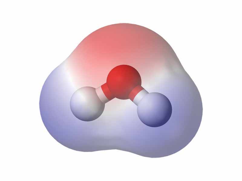 A commonly-used example of a polar compound is water (H2O). The electrons of water's hydrogen atoms are strongly attracted to the oxygen atom, and are actually closer to oxygen's nucleus than to the hydrogen nuclei; thus, water has a relatively strong negative charge in the middle (red shade), and a positive charge at the ends (blue shade).