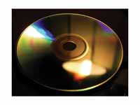 The grooves of a compact disc can act...