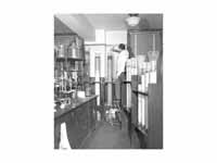 A chemist is shown using column chrom...